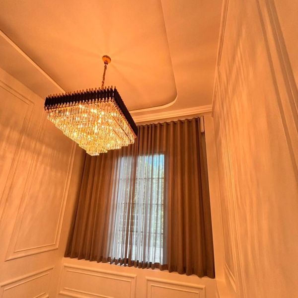 Dark fabric curtains installed near a staircase