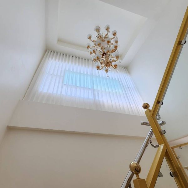 Curtains installed near a staircase