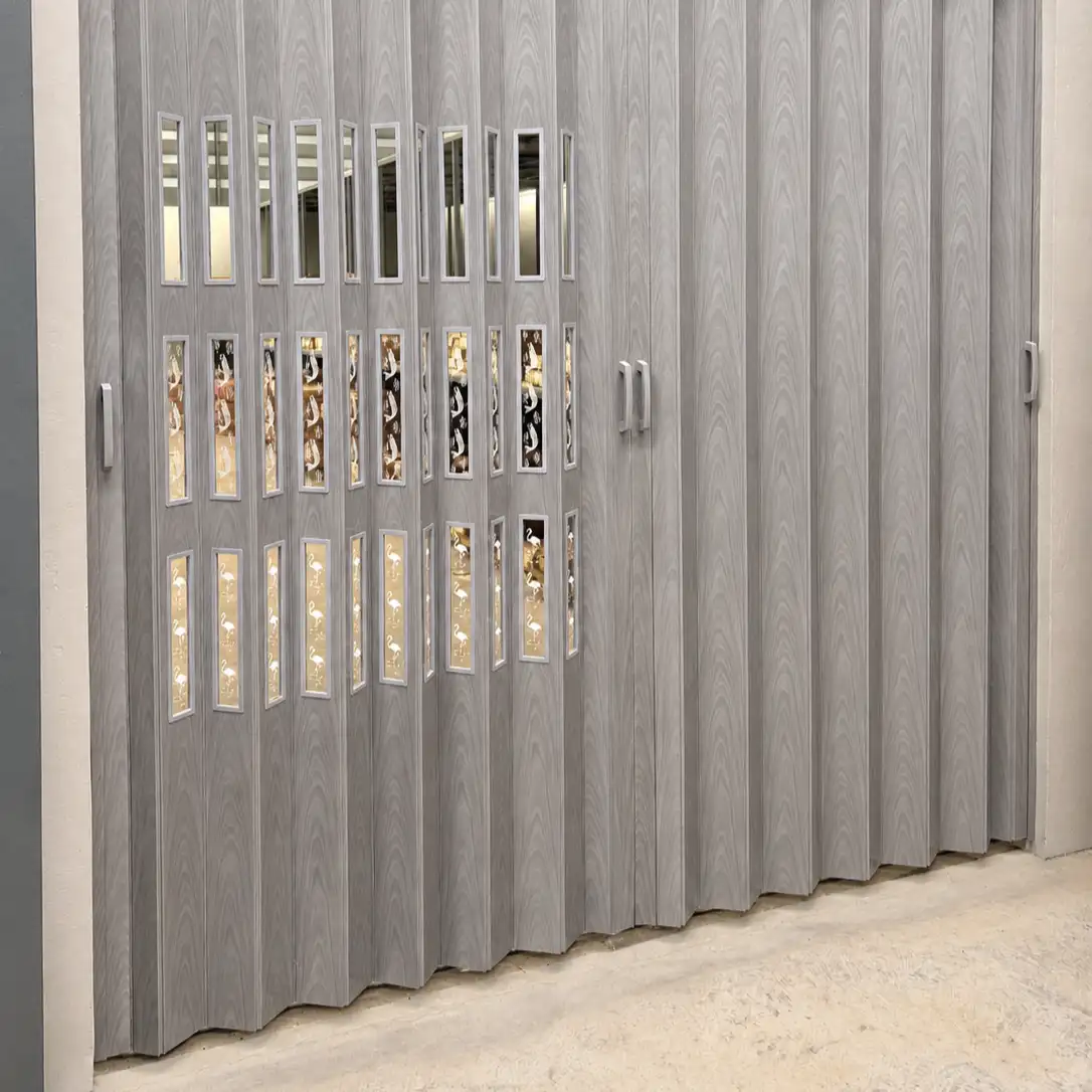 Grey wood-grain accordion room divider with decorative flamingo panel inserts